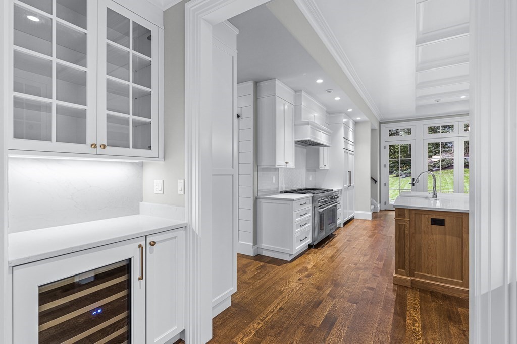 8 Lowell Road Wellesley, MA 02481 - Photo 11 of 16 a kitchen with stainless steel appliances a refrigerator and a stove top oven