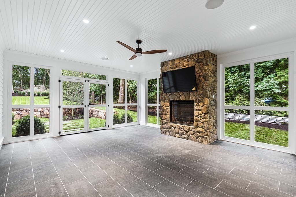 8 Lowell Road Wellesley, MA 02481 - Photo 13 of 16 a view of a room with furniture fireplace and windows