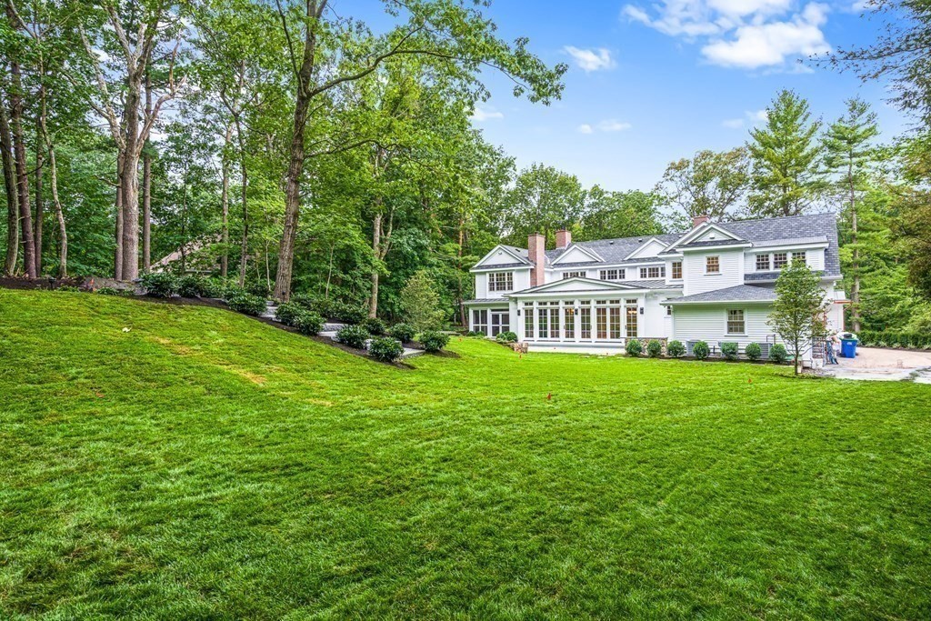 8 Lowell Road Wellesley, MA 02481 - Photo 16 of 16 a view of a house with a big yard and large trees
