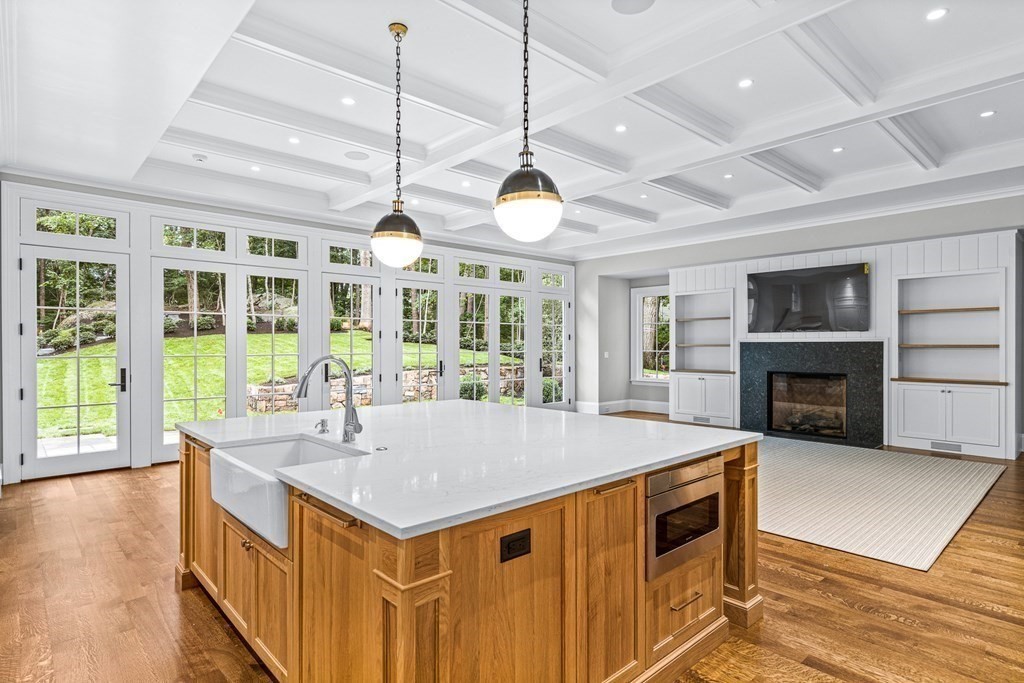 8 Lowell Road Wellesley, MA 02481 - Photo 4 of 16 a kitchen with a stove and a wooden floor