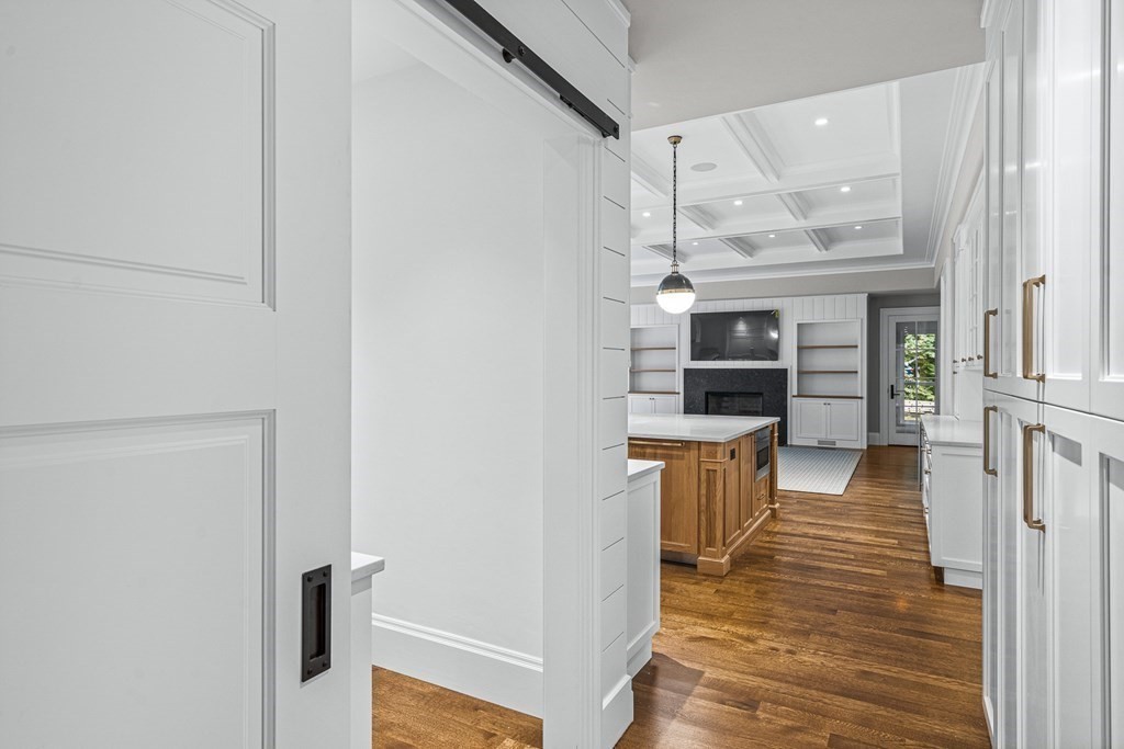 8 Lowell Road Wellesley, MA 02481 - Photo 10 of 16 a view of a kitchen from the hallway