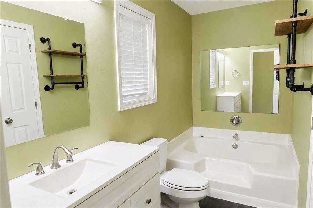 2033 Carson Segars Road Maysville, GA 30558 - Photo 28 of 41 a bathroom with a sink a toilet and shower