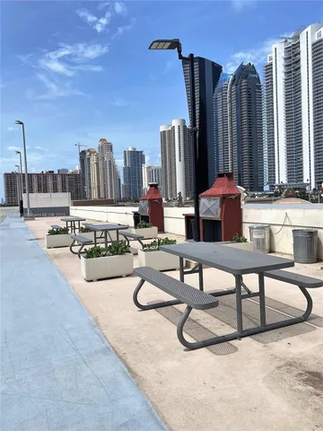 a living room with furniture a rug and a chandelier