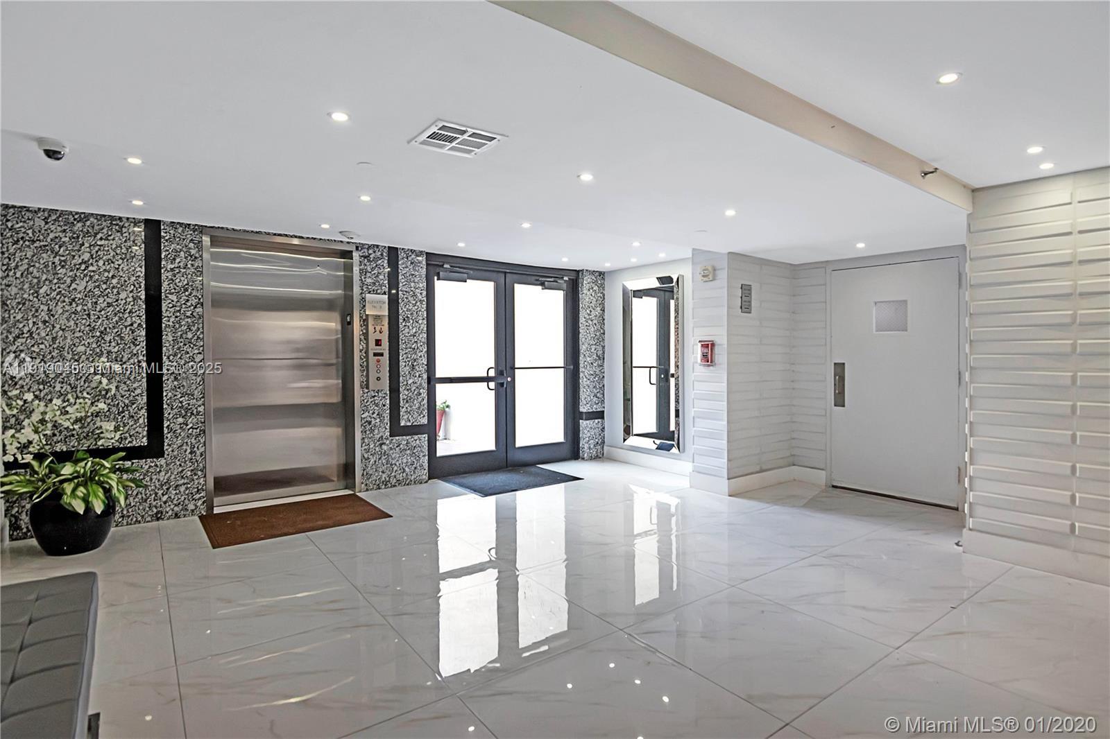 16919 North Bay Road, Unit 509 Sunny Isles Beach, FL 33160 - Photo 14 of 43 a view of an empty room with a fireplace