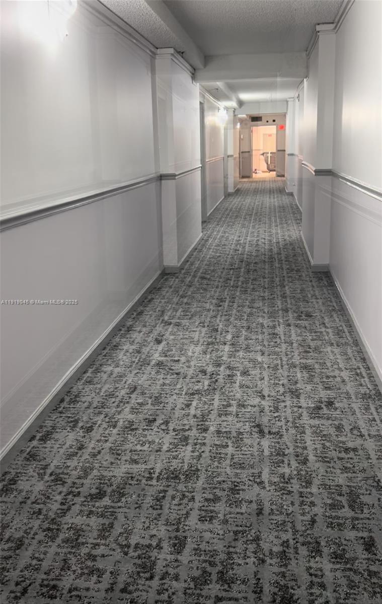 16919 North Bay Road, Unit 509 Sunny Isles Beach, FL 33160 - Photo 17 of 43 a view of empty room with wooden floor