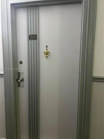 a bathroom with a shower and a door