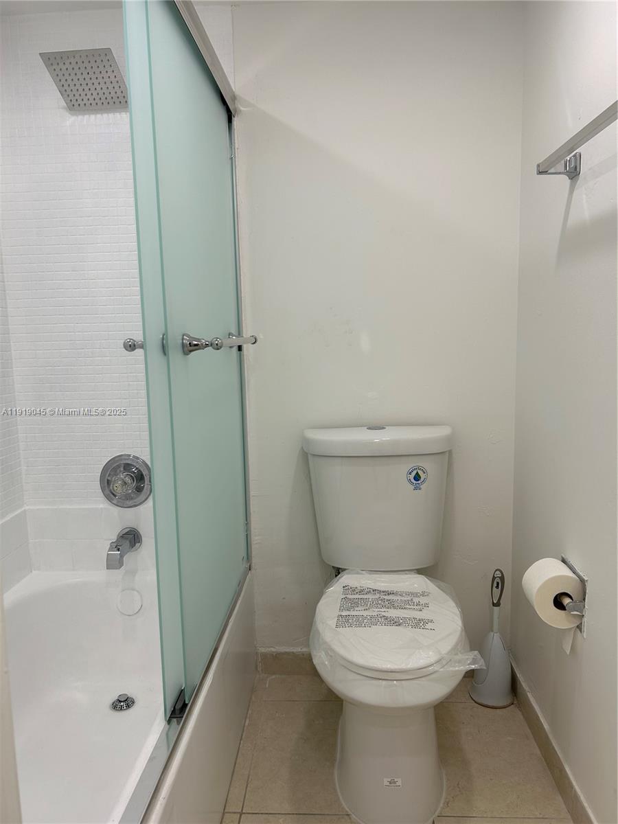 16919 North Bay Road, Unit 509 Sunny Isles Beach, FL 33160 - Photo 20 of 43 a bathroom with a toilet and a shower