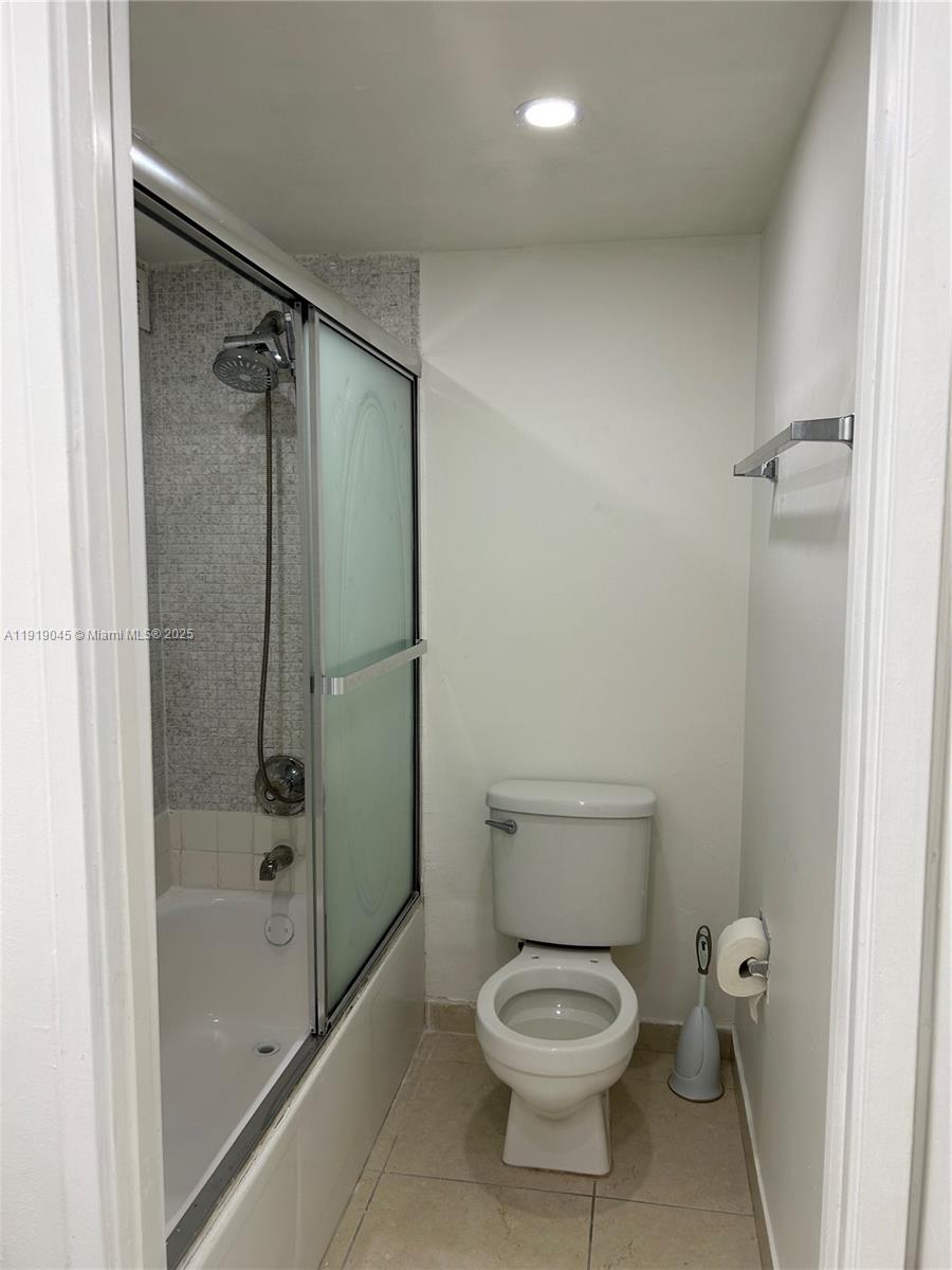 16919 North Bay Road, Unit 509 Sunny Isles Beach, FL 33160 - Photo 29 of 43 a bathroom with a toilet and a shower