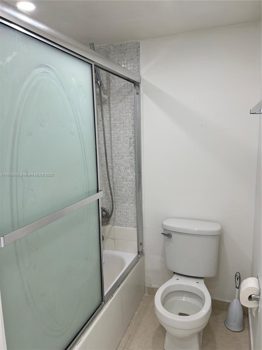 16919 North Bay Road, Unit 509 Sunny Isles Beach, FL 33160 - Photo 32 of 43 a white toilet sitting next to a shower