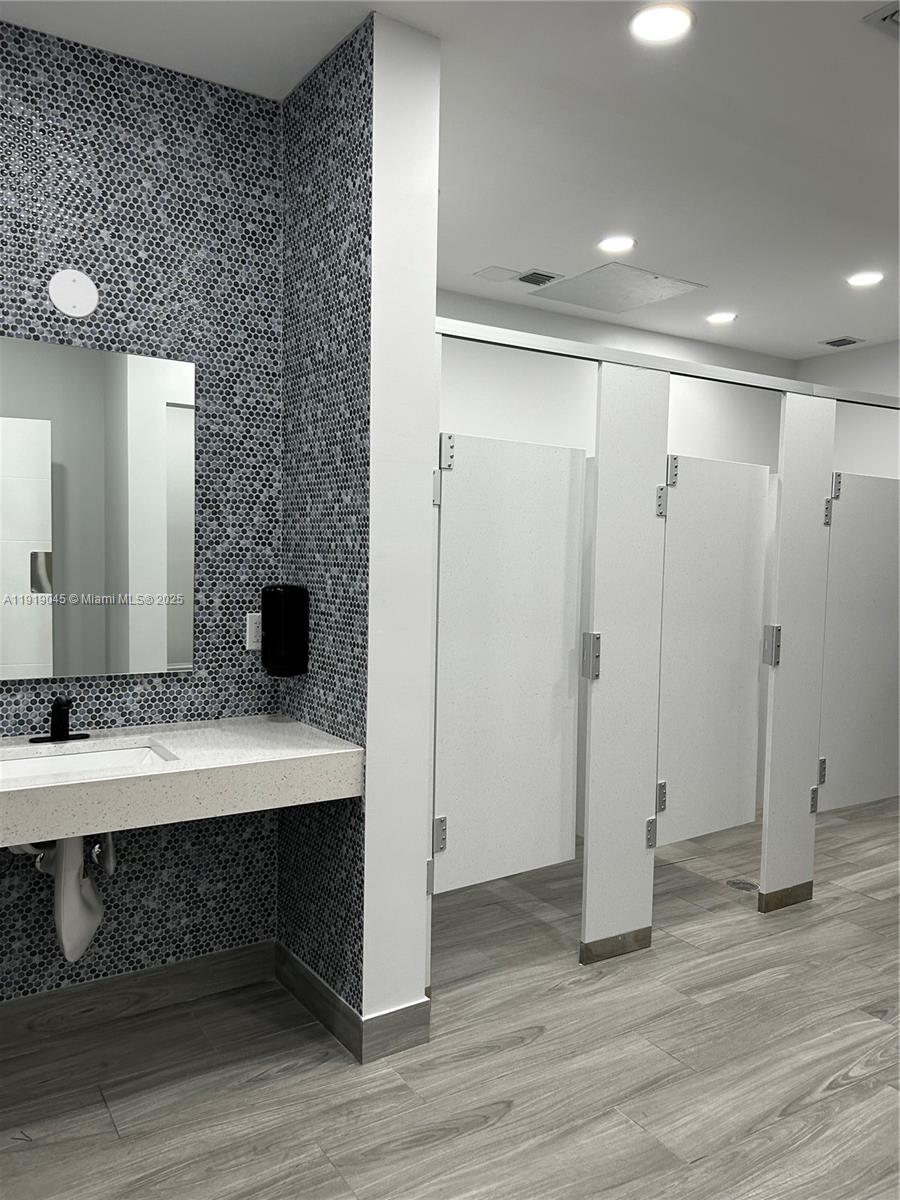 16919 North Bay Road, Unit 509 Sunny Isles Beach, FL 33160 - Photo 35 of 43 a view of a room with wooden floor and sink