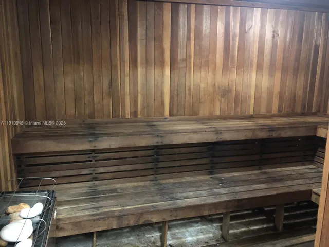 a bathroom with double vanity sink and a mirror