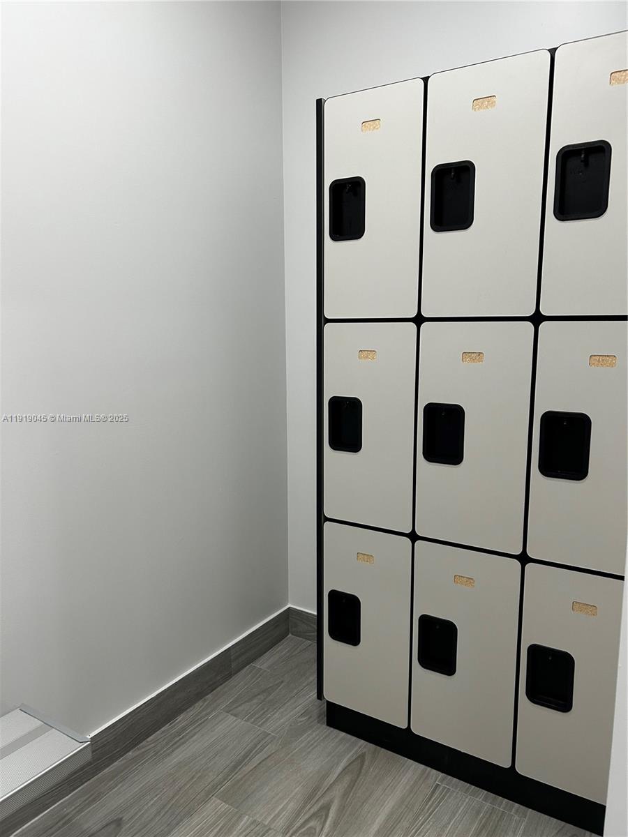 16919 North Bay Road, Unit 509 Sunny Isles Beach, FL 33160 - Photo 39 of 43 a view of a storage & utility room with wooden floor