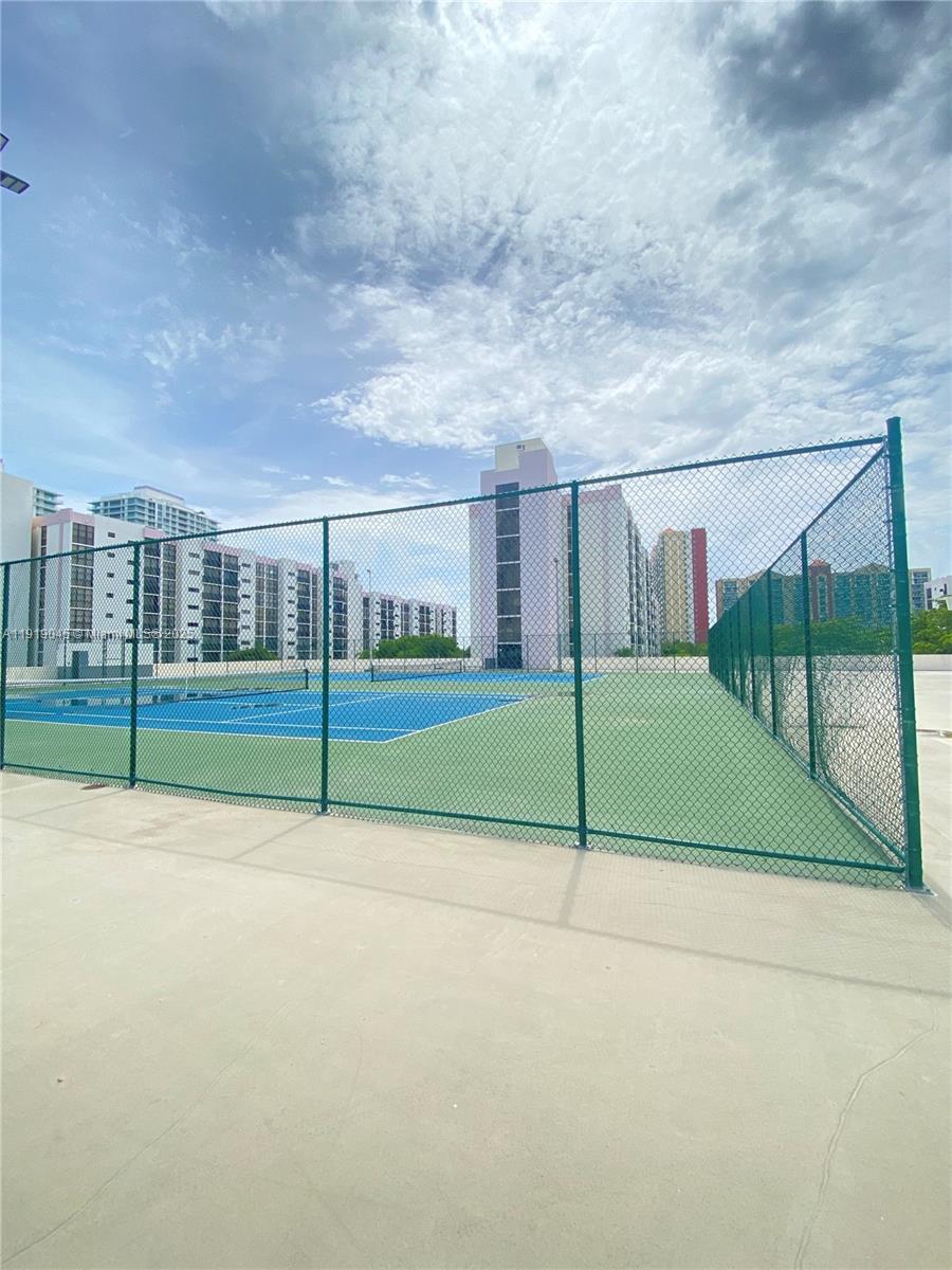 16919 North Bay Road, Unit 509 Sunny Isles Beach, FL 33160 - Photo 10 of 43 a view of a road with a big yard