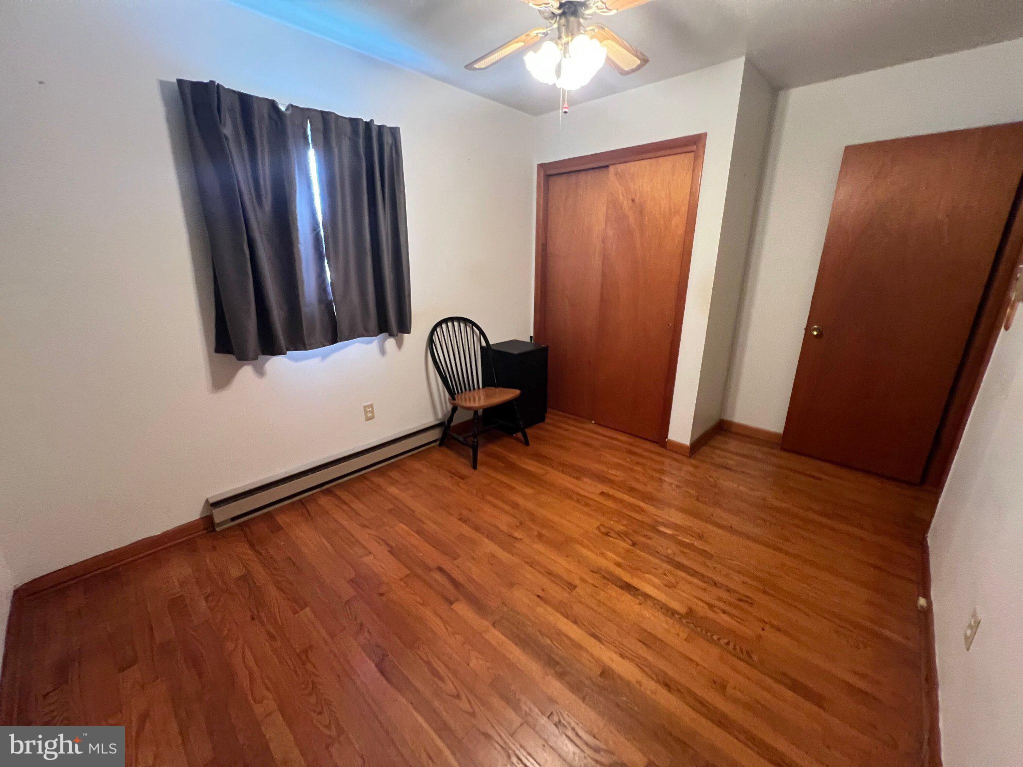 381 Co Rte 7/1 Augusta, WV 26704 - Photo 30 of 42 Cozy room with warm wooden floors.