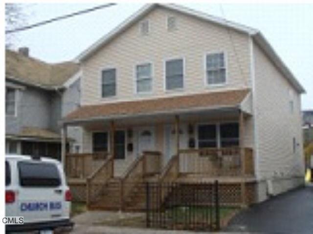 a front view of a house with garage