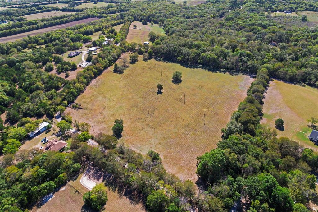 Tbd Wilson Road Whitewright, TX 75491 - Photo 4 of 16 aerial view of a house with a yard and large trees