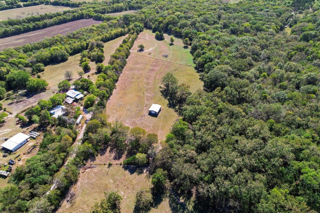 Tbd Wilson Road Whitewright, TX 75491 - Photo 5 of 16 an aerial view of a house with a yard and mountain view in back