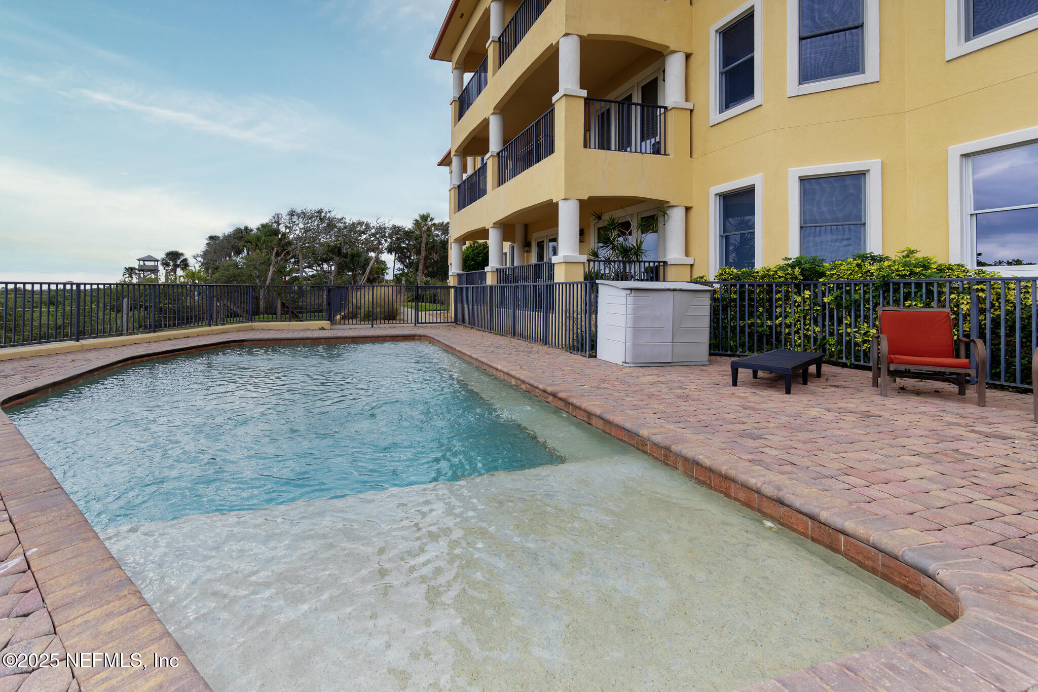 1 Radio Road, Unit 203 St. Augustine, FL 32084 - Photo 50 of 57 a swimming pool with outdoor seating and yard