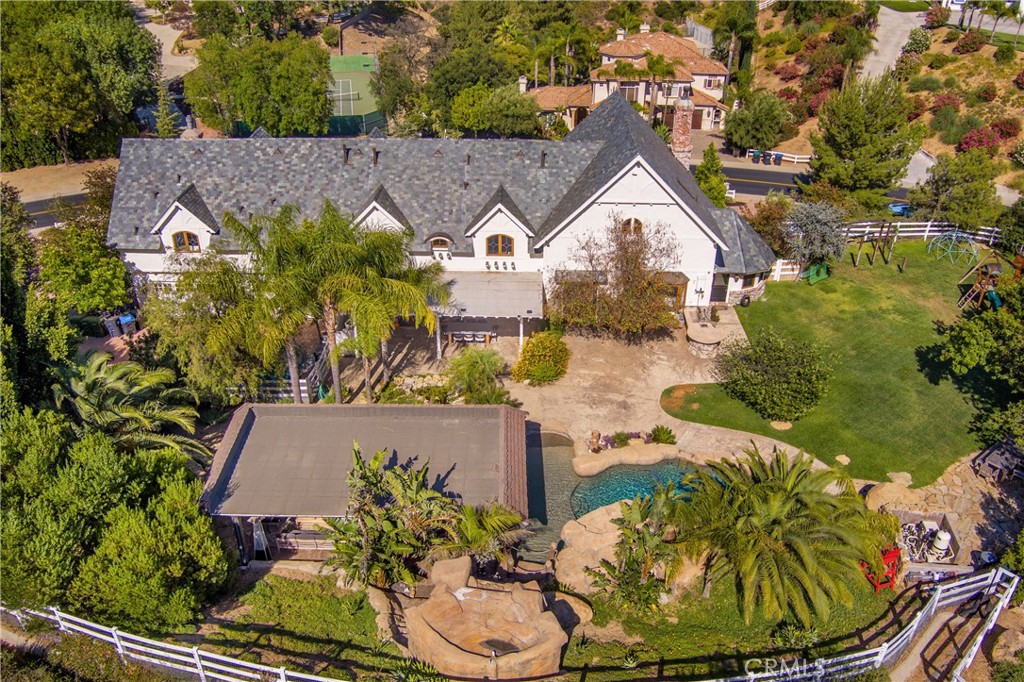 85 Saddlebow Road Bell Canyon, CA 91307 - Photo 69 of 75 an aerial view of a house with a yard and a large tree