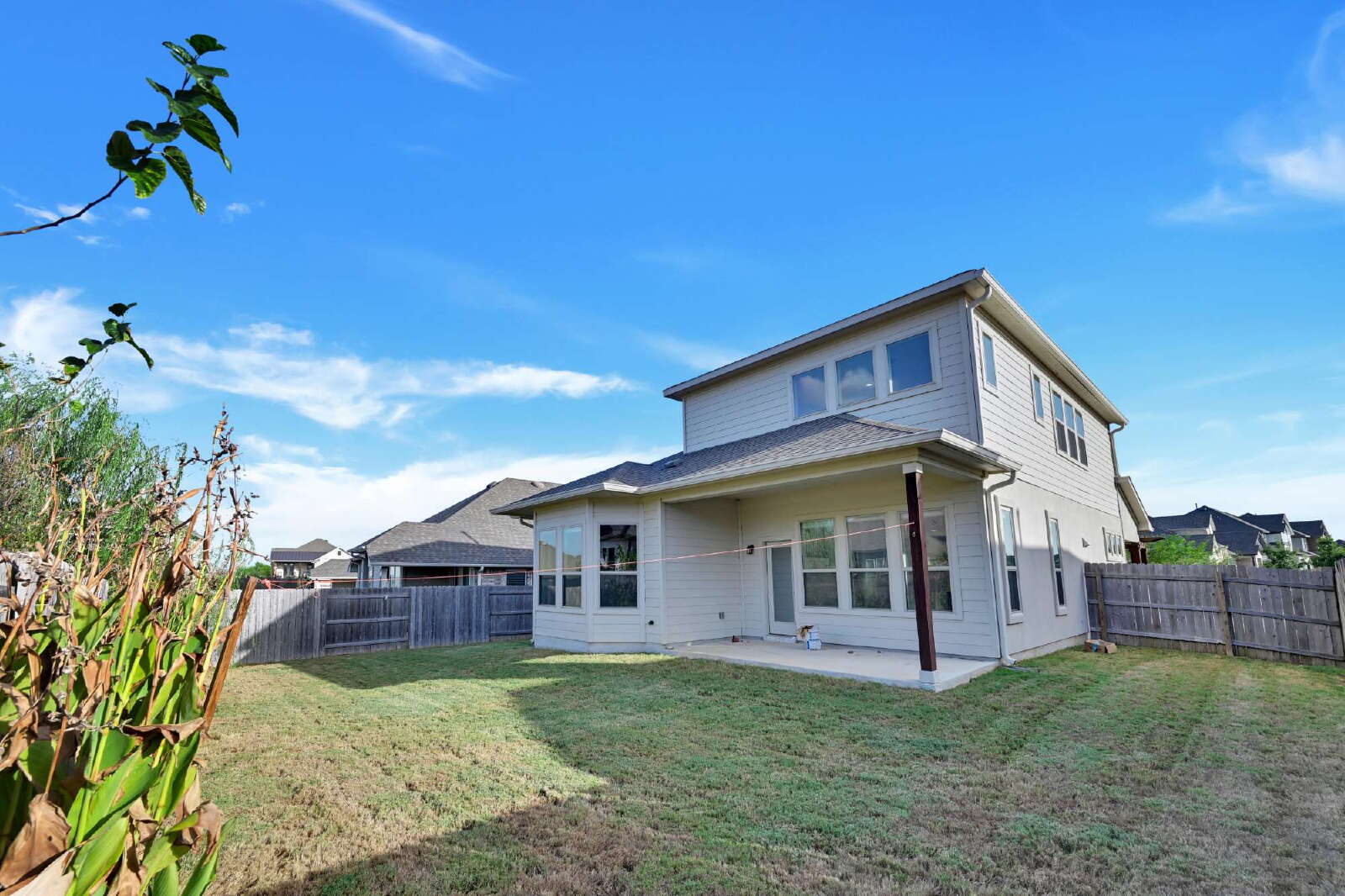 4420 Kings Cross Road Pflugerville, TX 78660 - Photo 22 of 25 A spacious grassy lawn surrounds the rear of this two-story home.