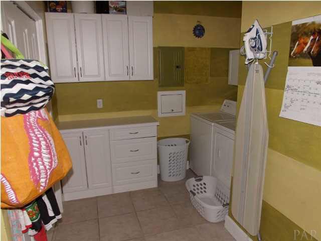 12469 Red Cloud Road Pensacola, FL 32507 - Photo 11 of 20 Big laundry utility room with plenty of space and that leads to garage