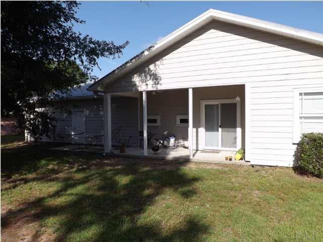 12469 Red Cloud Road Pensacola, FL 32507 - Photo 3 of 20 Back yard with a cover porch to relax on.