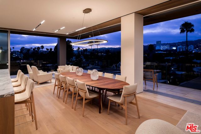 a outdoor dining space with furniture and a potted plant