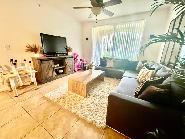 a living room with furniture and a flat screen tv