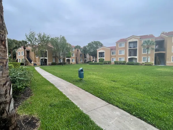 a view of a building with a yard