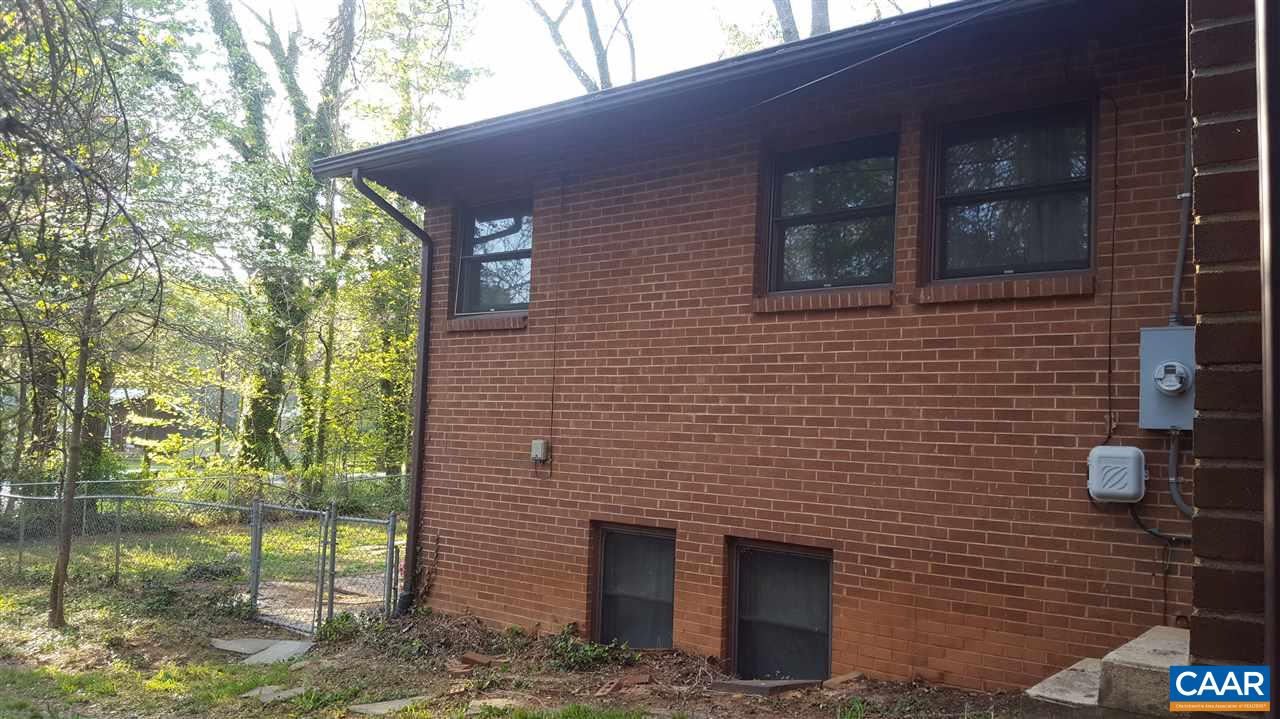111 Apple Tree Road Charlottesville, VA 22903 - Photo 17 of 19 a brick house with a yard