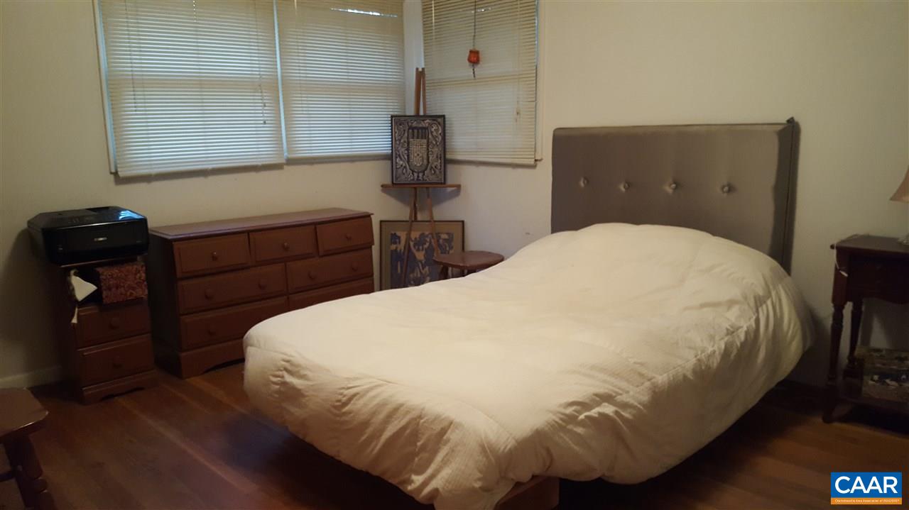 111 Apple Tree Road Charlottesville, VA 22903 - Photo 7 of 19 a bedroom with a bed and wooden floor