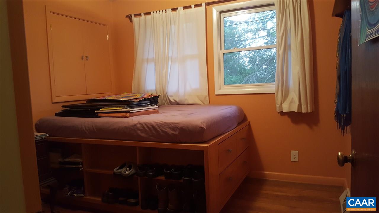 111 Apple Tree Road Charlottesville, VA 22903 - Photo 10 of 19 a bedroom with a bed and a window