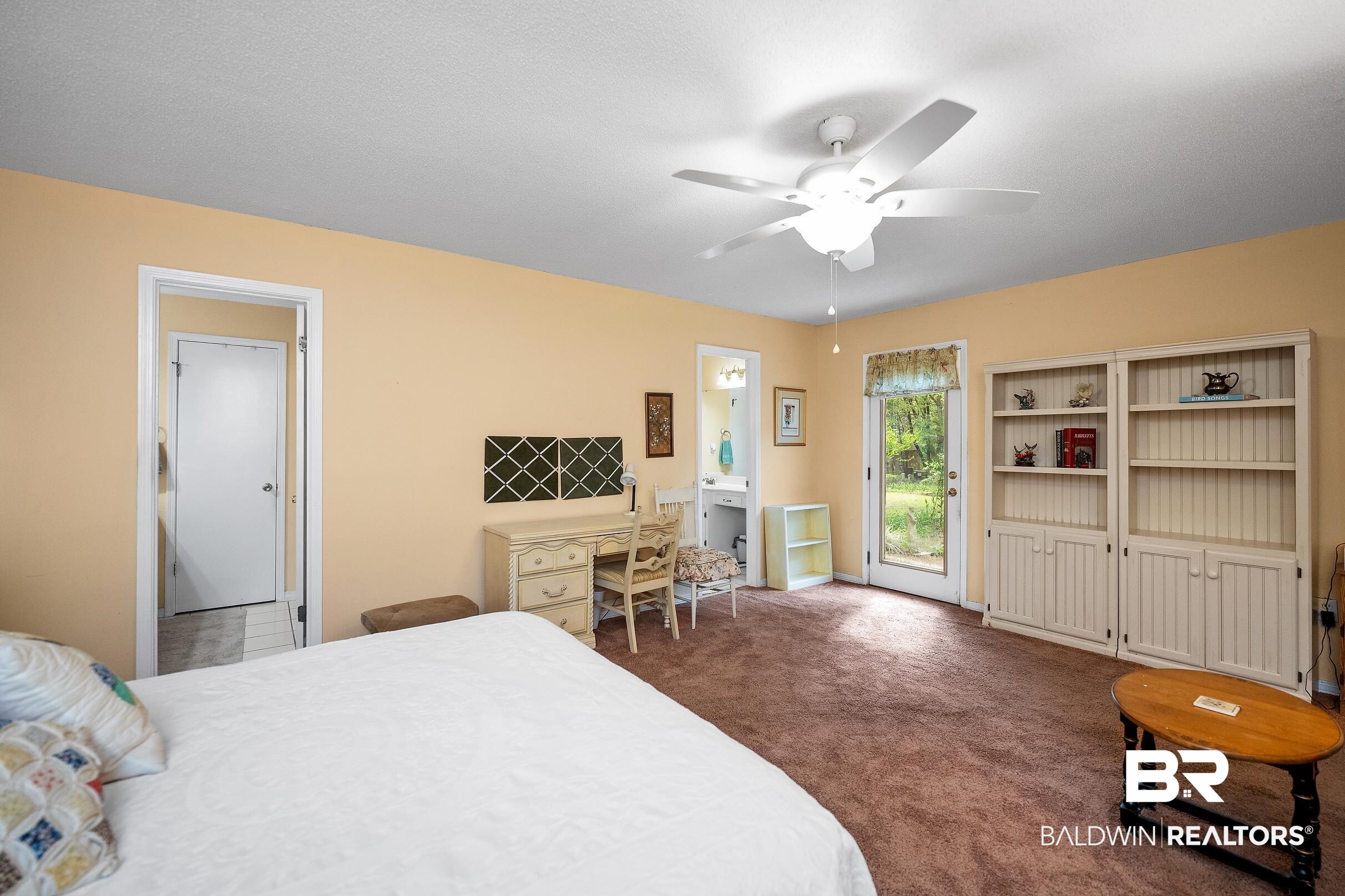 4026 Kingsrow Row Mobile, AL 36619 - Photo 20 of 51 Bedroom with dark carpet, ceiling fan, ensuite bath, and access to outside