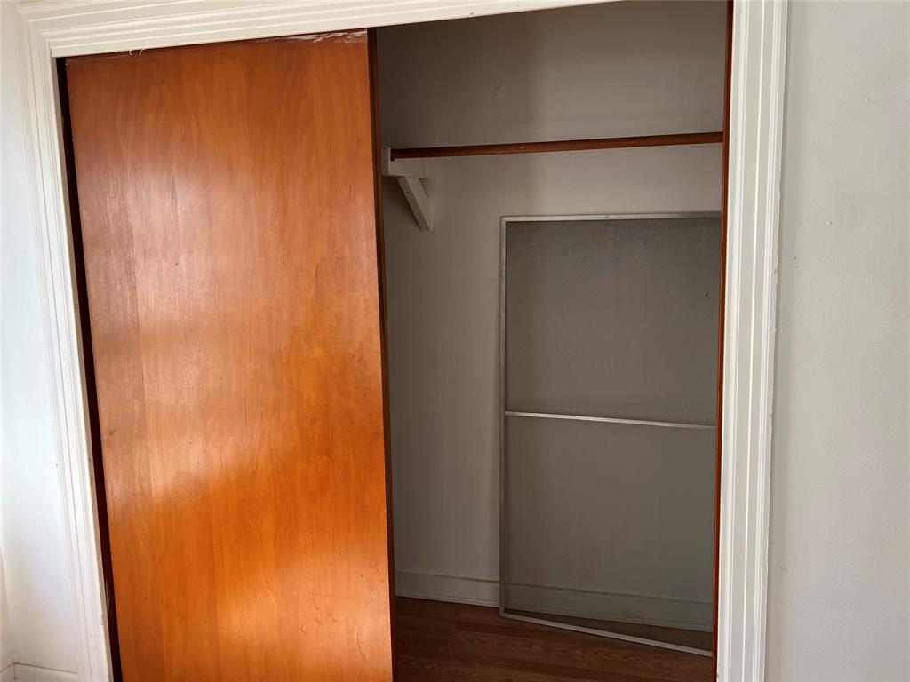 1401 Polk Street Wichita Falls, TX 76309 - Photo 24 of 29 a view of walk in closet with wooden floor