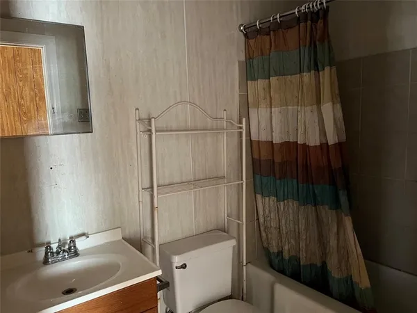 a bathroom with a sink and a shower
