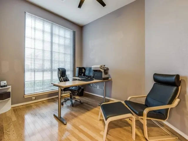 a workspace with furniture and a window