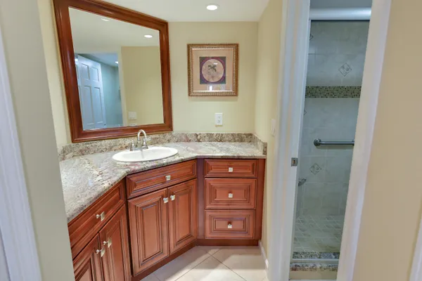 a white toilet sitting next to a bathroom sink