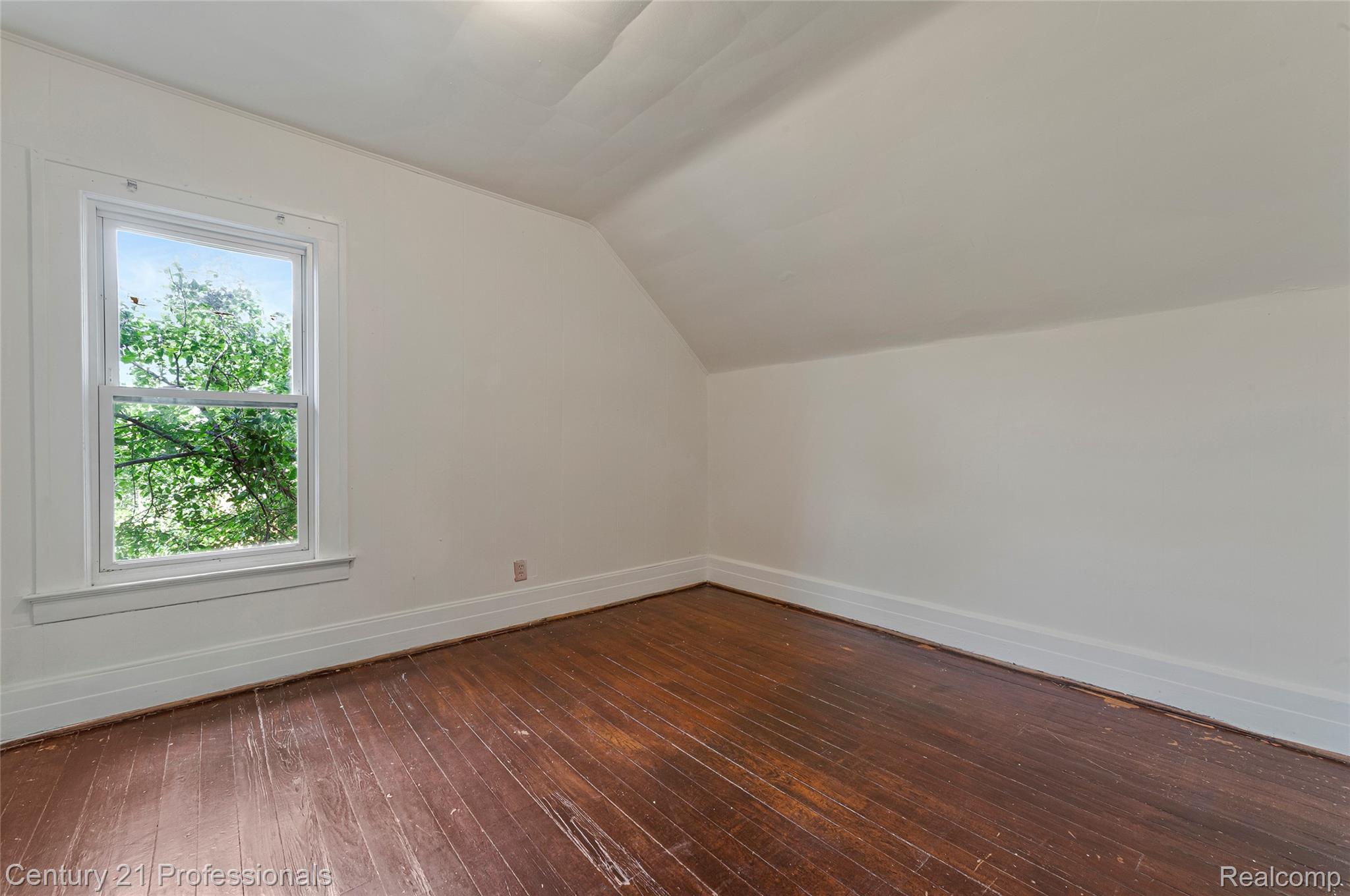 238 Richter Street River Rouge, MI 48218 - Photo 18 of 33 Interior room featuring rich wood-finish flooring and a single window with white trim