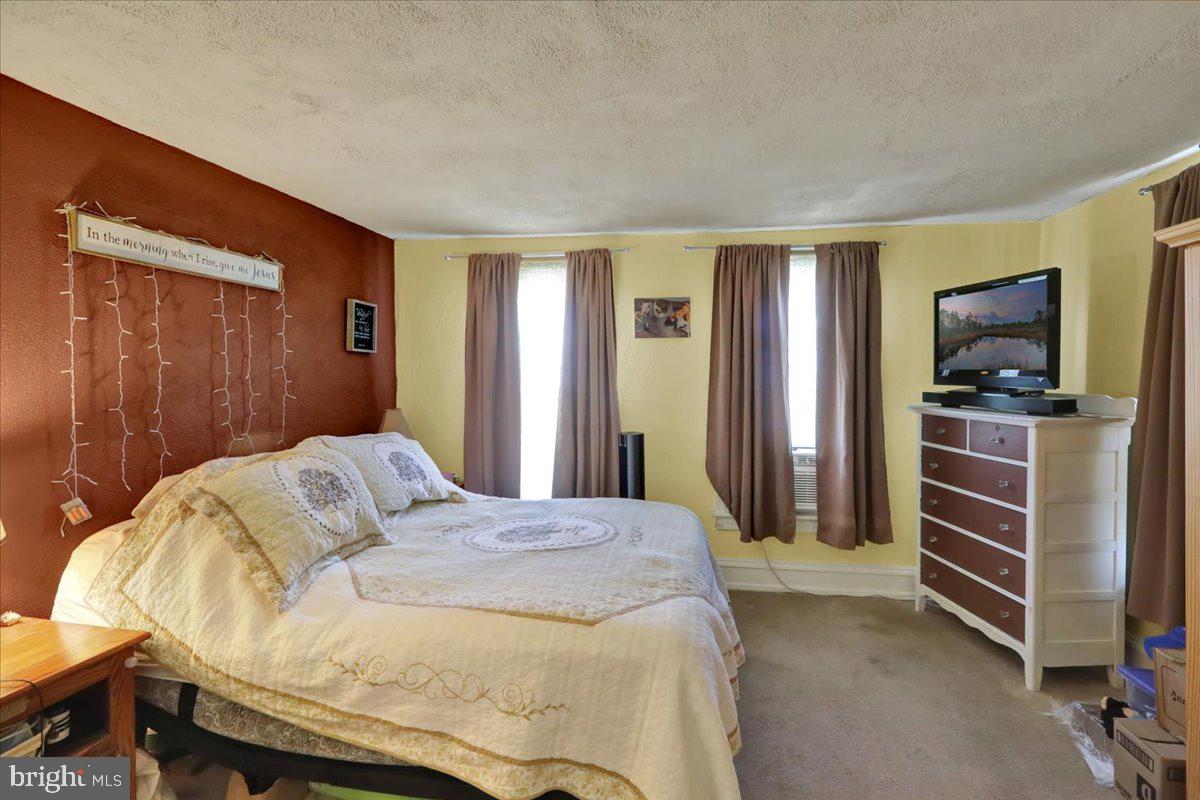 258 East Walnut Street Kutztown, PA 19530 - Photo 18 of 30 a bedroom with a bed and a television in it