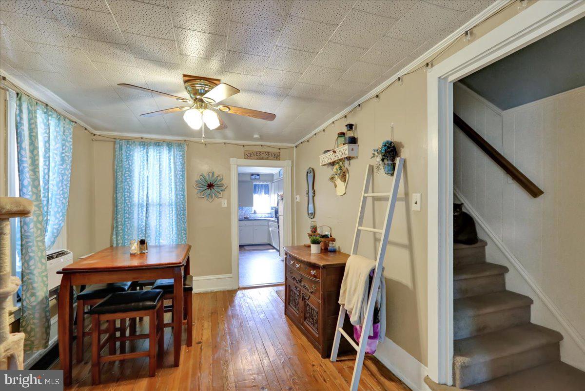 258 East Walnut Street Kutztown, PA 19530 - Photo 6 of 30 a view of a hallway with wooden floor and workspace