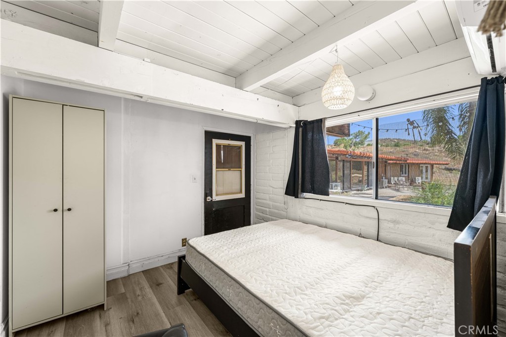 6308 Hawarden Drive Riverside, CA 92506 - Photo 28 of 37 a room with a bed and a large window