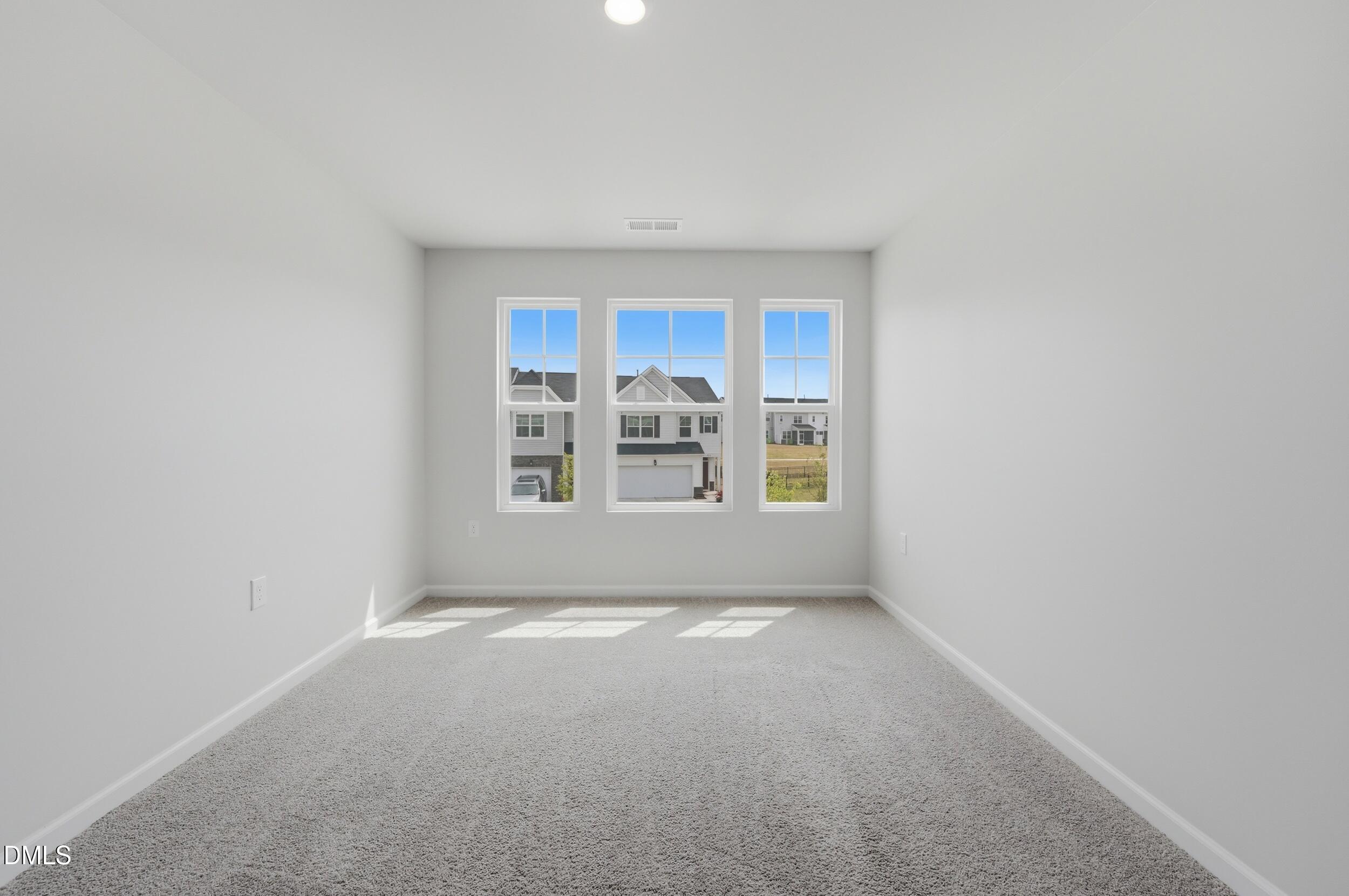5011 Kota Street Raleigh, NC 27610 - Photo 21 of 42 a view of an empty room with a window