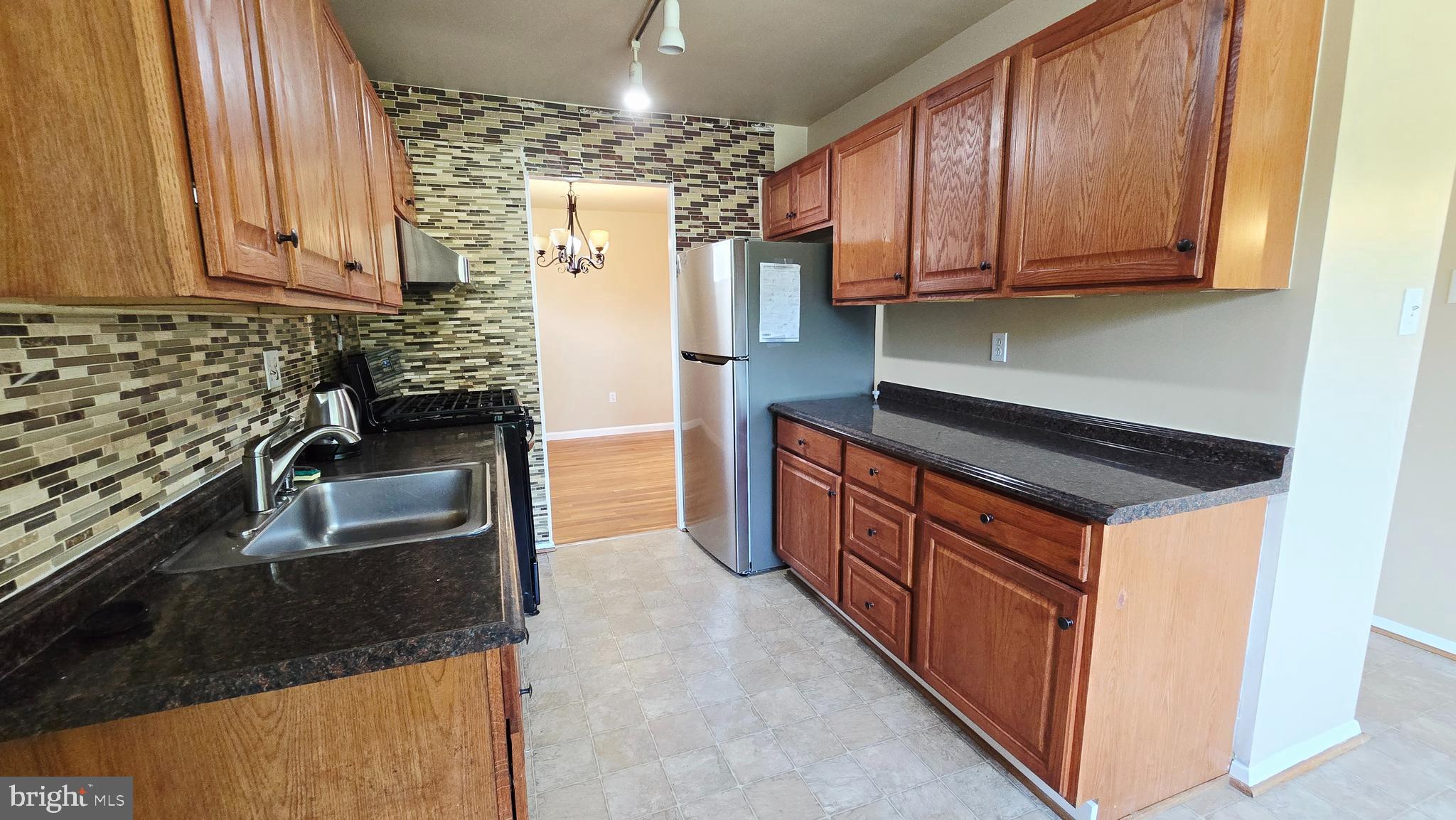 5020 Paducah Road College Park, MD 20740 - Photo 17 of 64 Kitchen with granite and backsplash