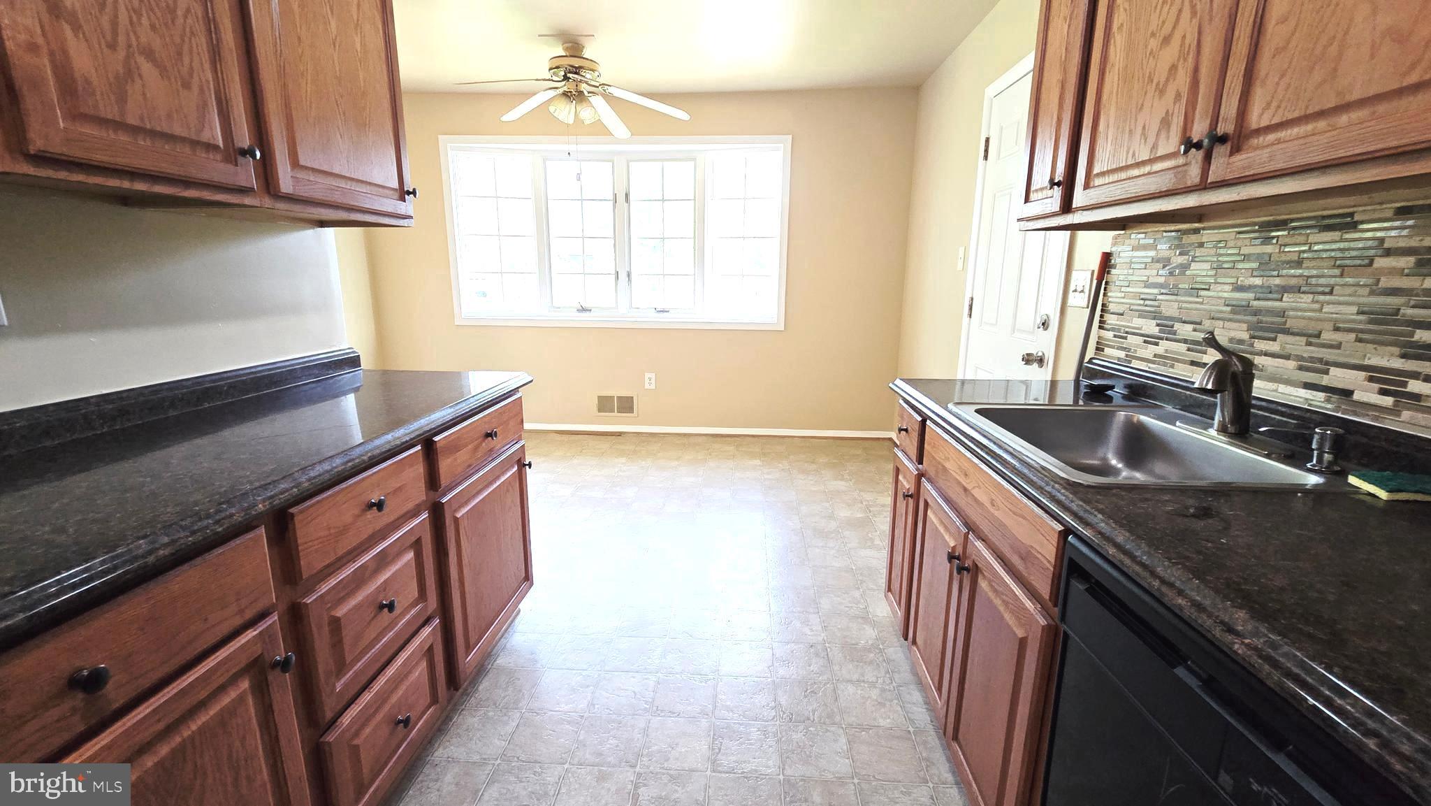 5020 Paducah Road College Park, MD 20740 - Photo 21 of 64 Kitchen with granite and backsplash
