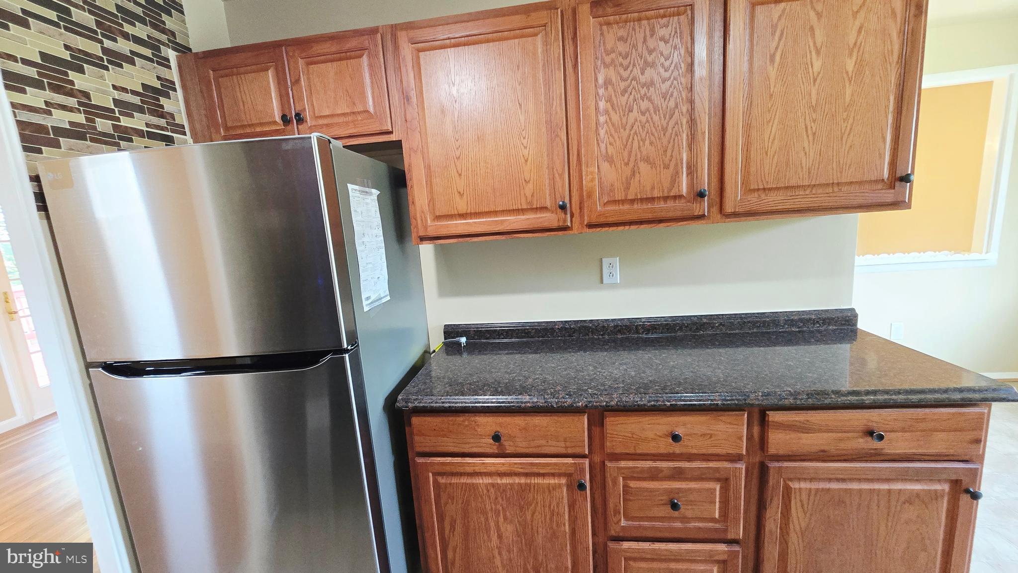 5020 Paducah Road College Park, MD 20740 - Photo 22 of 64 Kitchen with granite and backsplash