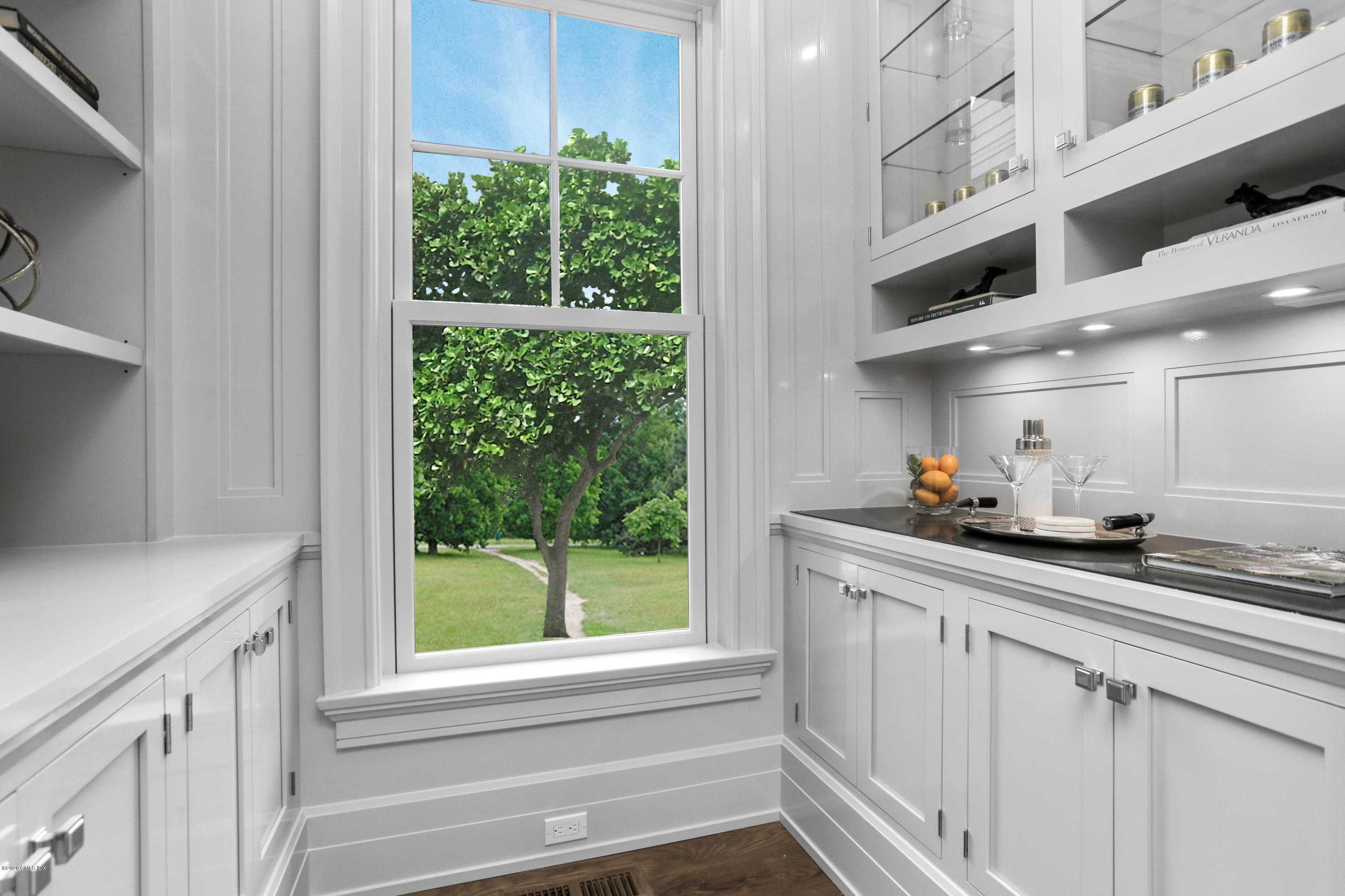 498 Lake Avenue Greenwich, CT 06830 - Photo 13 of 37 a kitchen with stainless steel appliances white cabinets and a window
