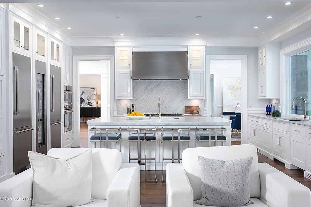 498 Lake Avenue Greenwich, CT 06830 - Photo 15 of 37 a living room with stainless steel appliances granite countertop furniture and a view of kitchen