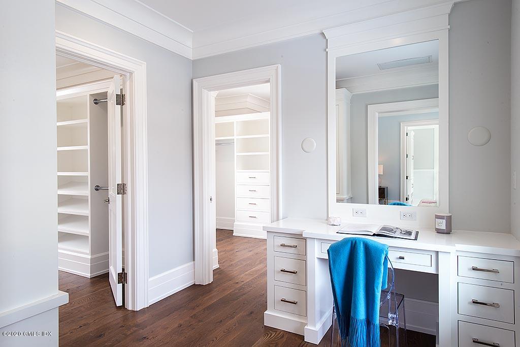 498 Lake Avenue Greenwich, CT 06830 - Photo 30 of 37 a bathroom with a granite countertop sink and a mirror