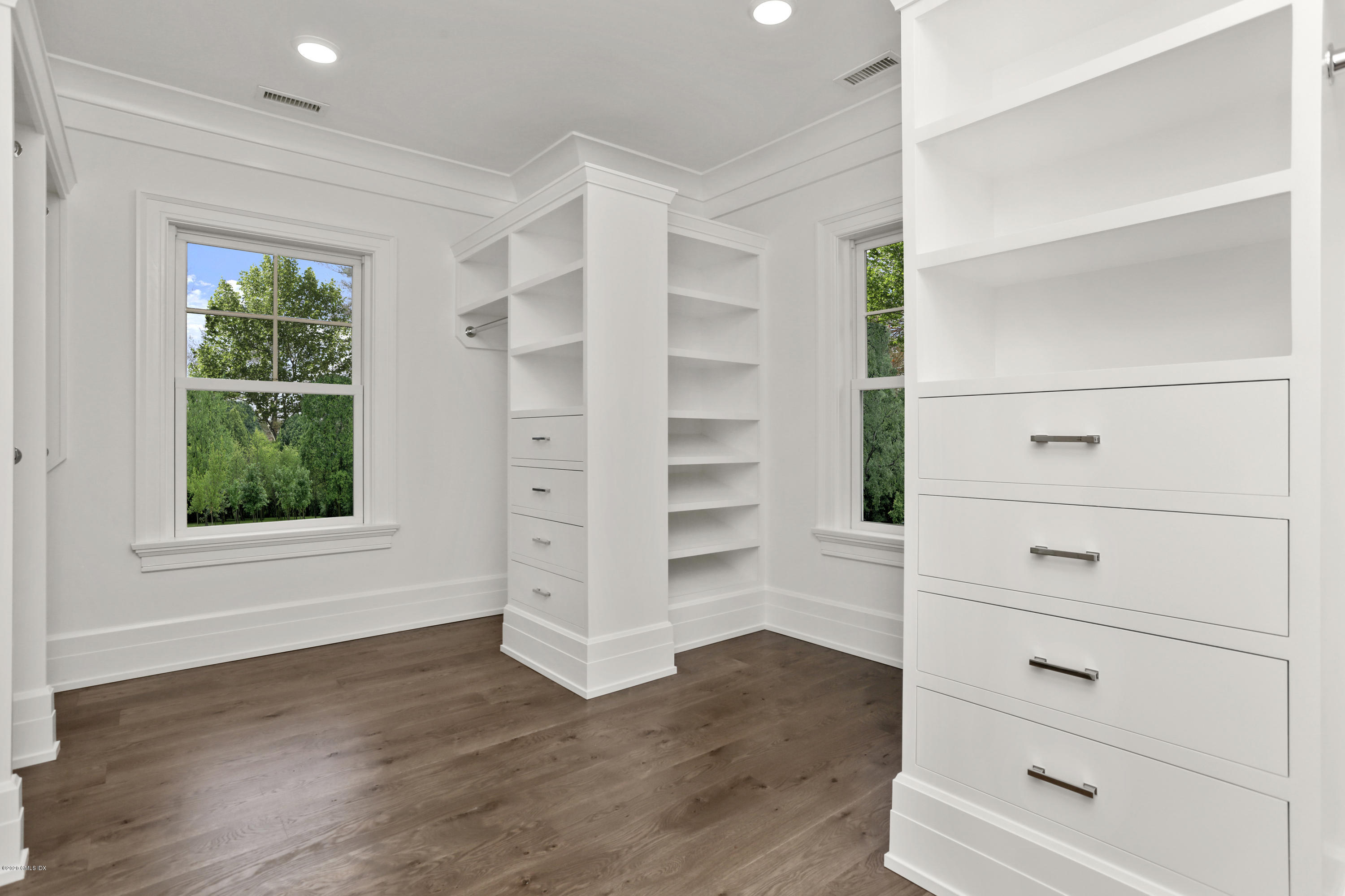 498 Lake Avenue Greenwich, CT 06830 - Photo 31 of 37 a view of walk in closet with wooden floor