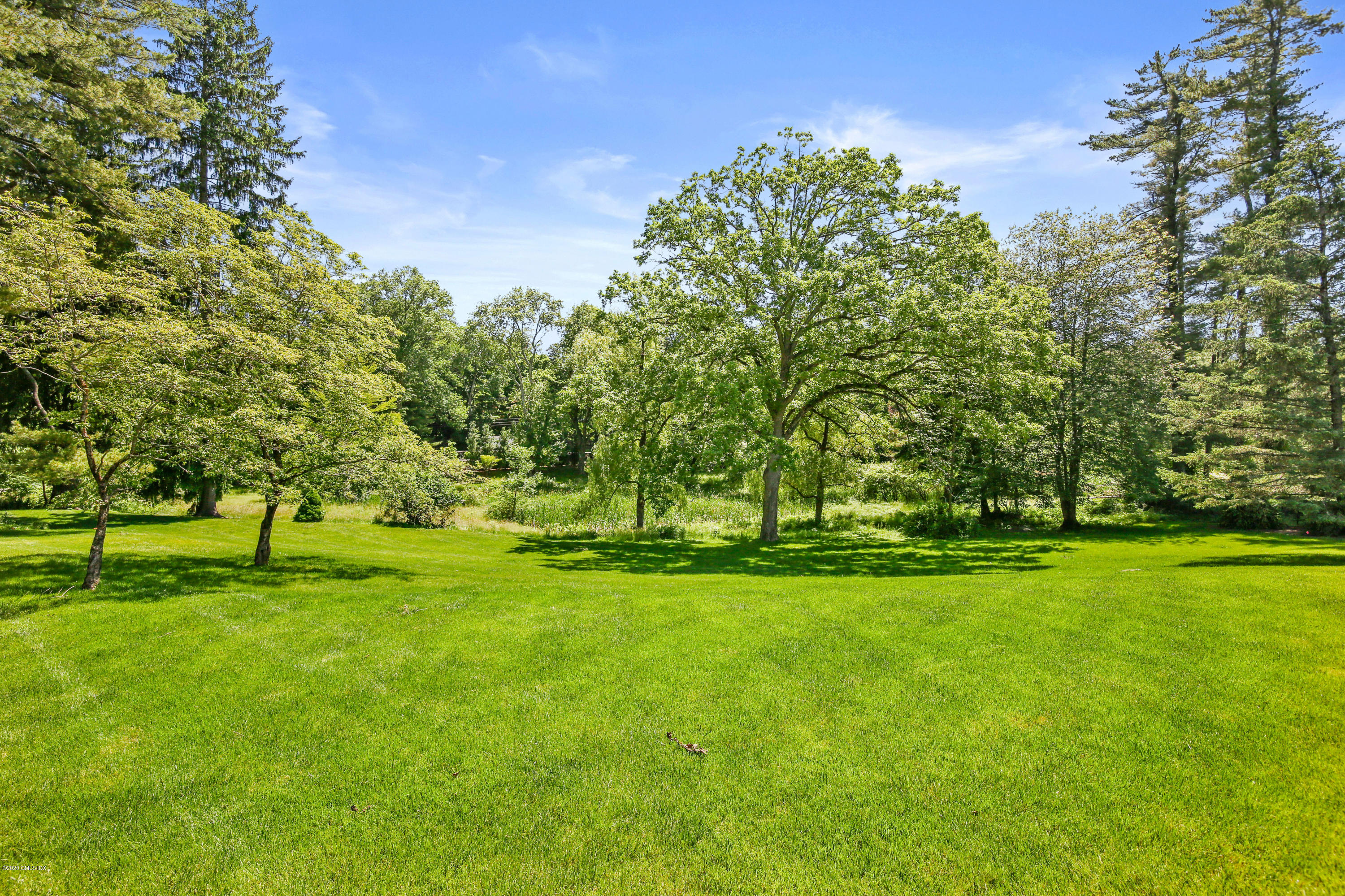 498 Lake Avenue Greenwich, CT 06830 - Photo 35 of 37 a green field with lots of trees in it